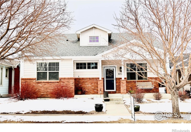 view of front of house featuring brick siding