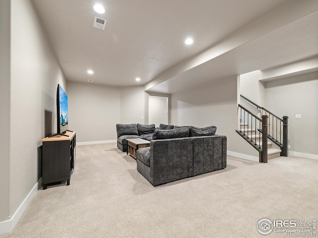 living room featuring visible vents, baseboards, light colored carpet, stairway, and recessed lighting