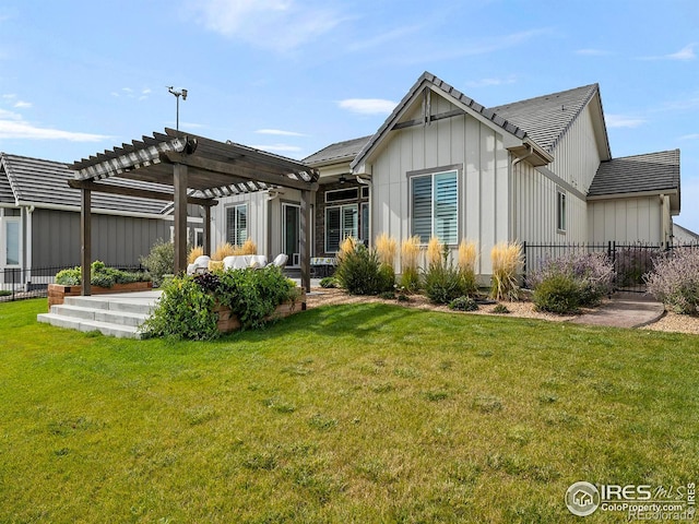 back of property featuring fence, a lawn, a pergola, board and batten siding, and a patio area