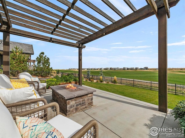 view of patio featuring a rural view, an outdoor living space with a fire pit, a fenced backyard, and a pergola