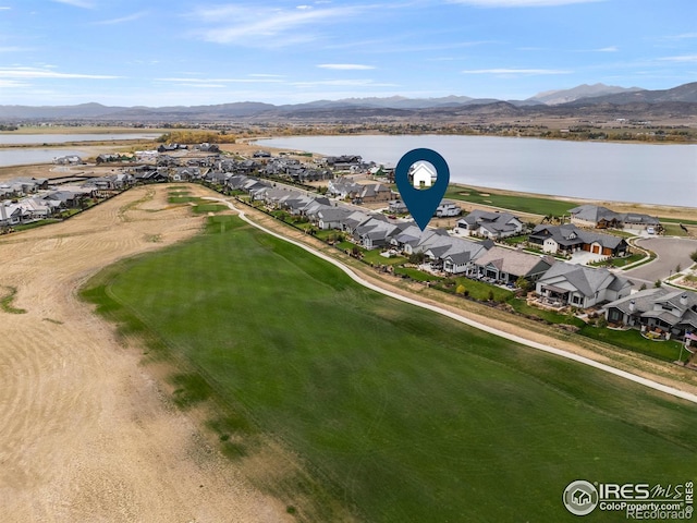 birds eye view of property featuring a residential view and a water and mountain view