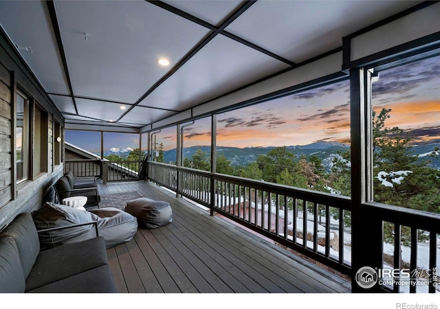 deck at dusk with a mountain view