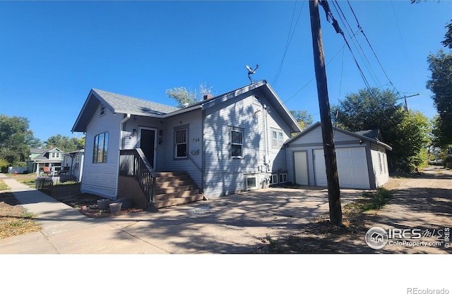 view of front of property with an outbuilding and a garage