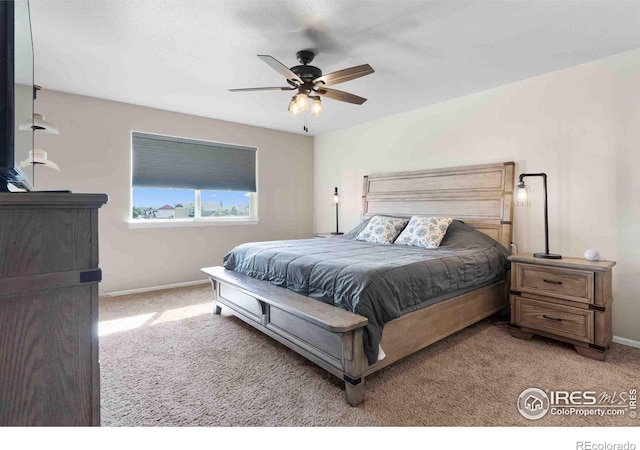 bedroom with light colored carpet and ceiling fan