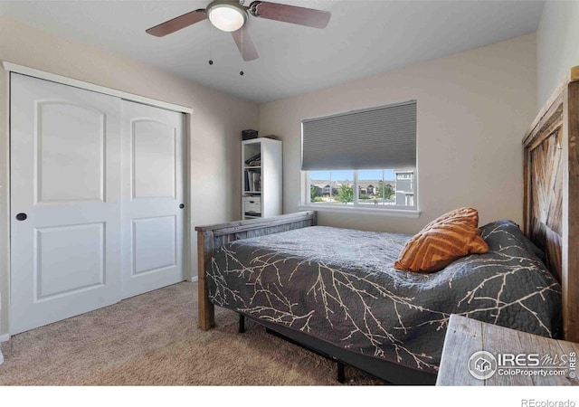 bedroom with carpet, ceiling fan, and a closet