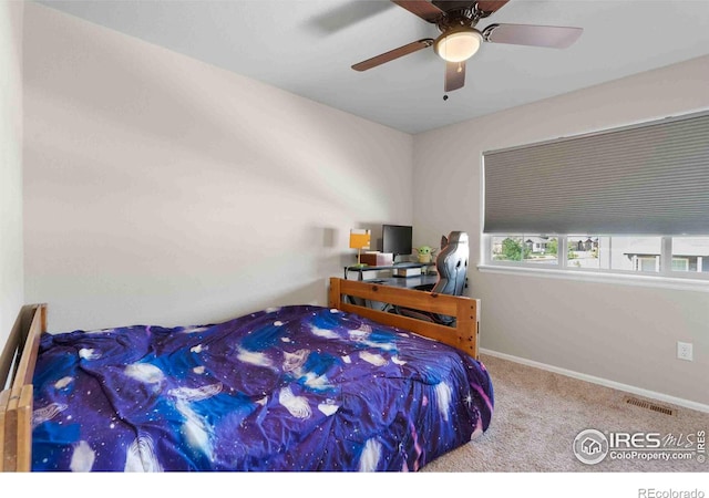 carpeted bedroom with ceiling fan