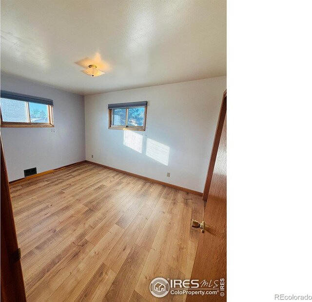 180 W 3rd St S, Cheyenne Wells, CO 80810 - empty room with light wood finished floors and baseboards