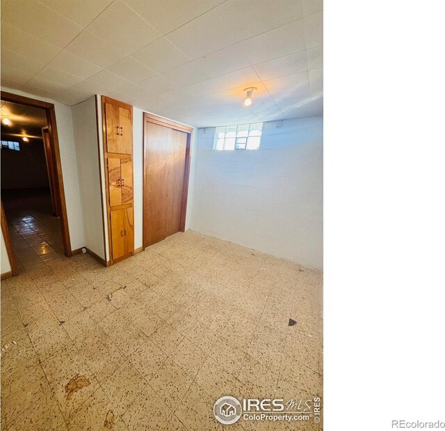 180 W 3rd St S, Cheyenne Wells, CO 80810 - unfurnished bedroom featuring tile patterned floors and a closet