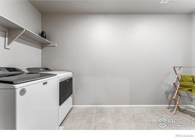 laundry area featuring independent washer and dryer