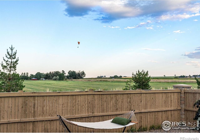 view of yard with a rural view