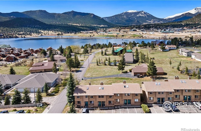 bird's eye view with a water and mountain view