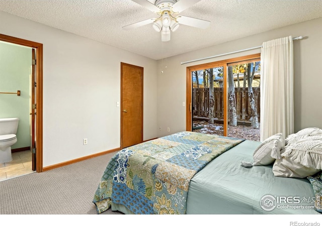 bedroom featuring ceiling fan, connected bathroom, access to exterior, and a textured ceiling