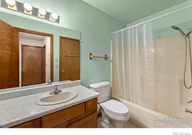 full bathroom with toilet, vanity, tile patterned flooring, and shower / bathtub combination with curtain