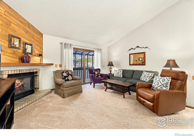 carpeted living room with a fireplace, wood walls, a textured ceiling, and lofted ceiling