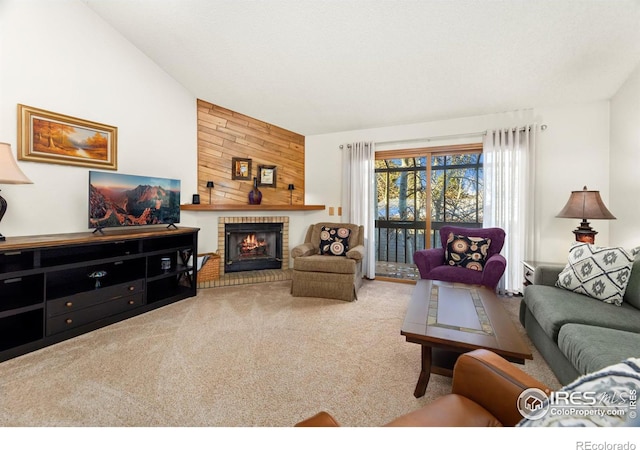 carpeted living room featuring vaulted ceiling and a brick fireplace