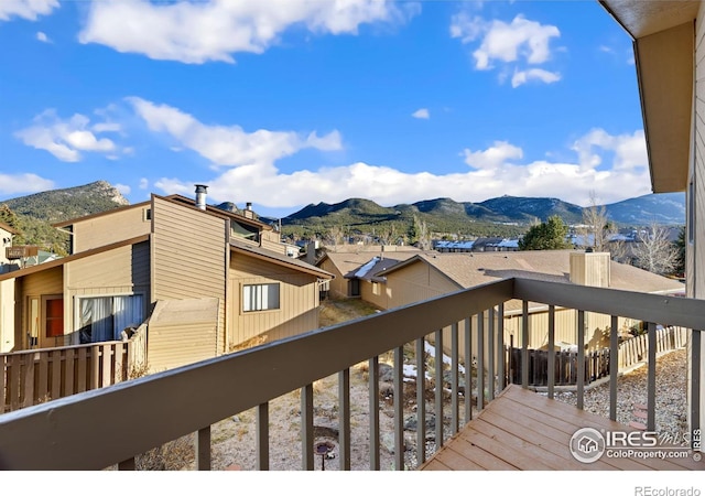 wooden terrace featuring a mountain view