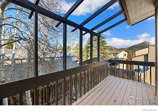 wooden deck with a mountain view