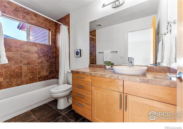 full bathroom with tile patterned flooring, vanity, toilet, and shower / bath combo with shower curtain