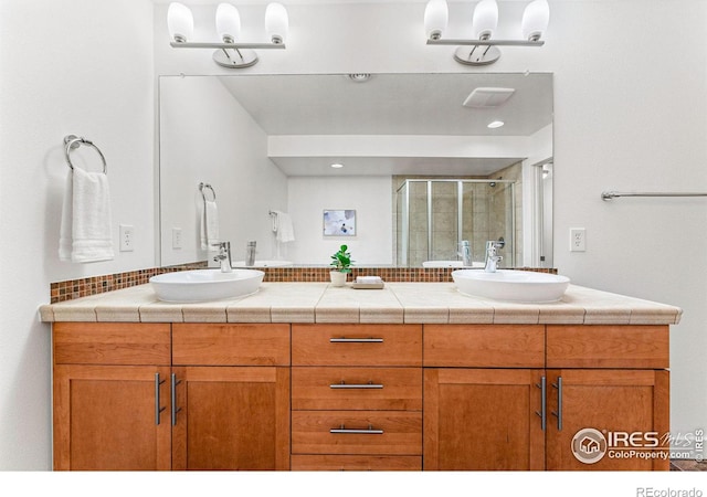 bathroom featuring vanity and walk in shower