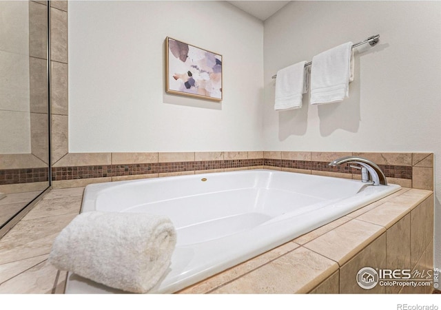 bathroom with tiled tub