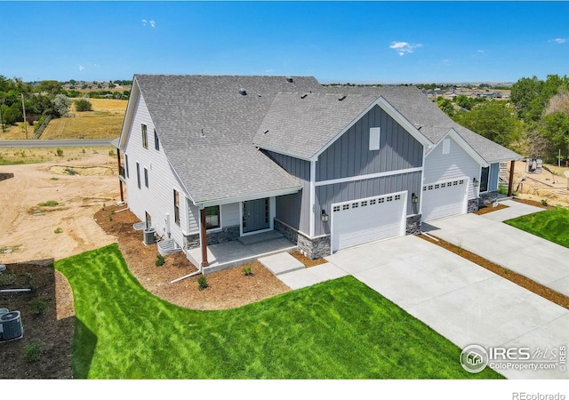 view of front of home featuring a garage and a front yard