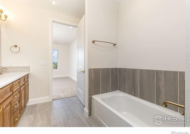 bathroom featuring vanity and a bathtub