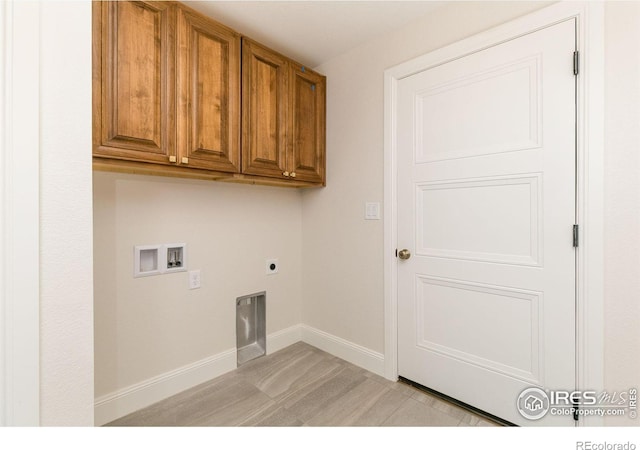 laundry room featuring cabinets, washer hookup, and hookup for an electric dryer