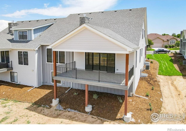 back of property featuring covered porch