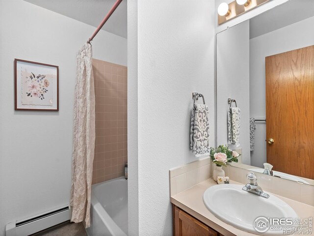 bathroom with vanity, shower / tub combo, and a baseboard heating unit