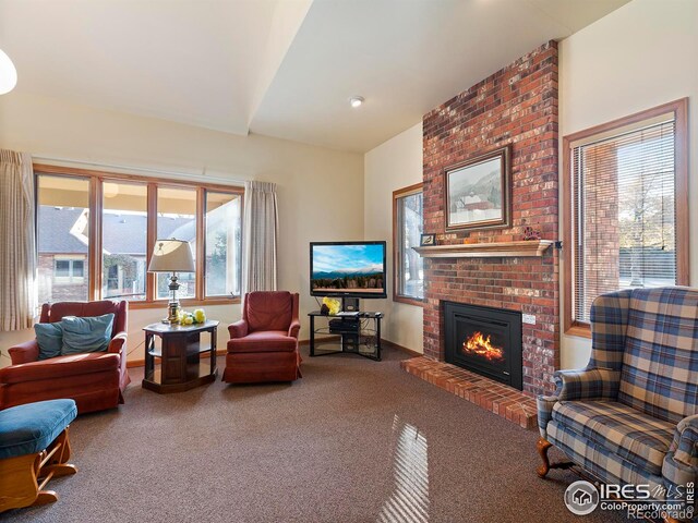 carpeted living room with a fireplace