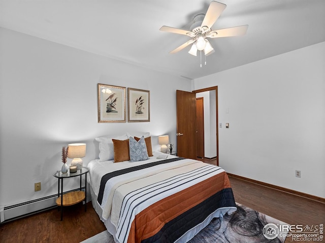 bedroom featuring a baseboard heating unit, dark hardwood / wood-style floors, and ceiling fan