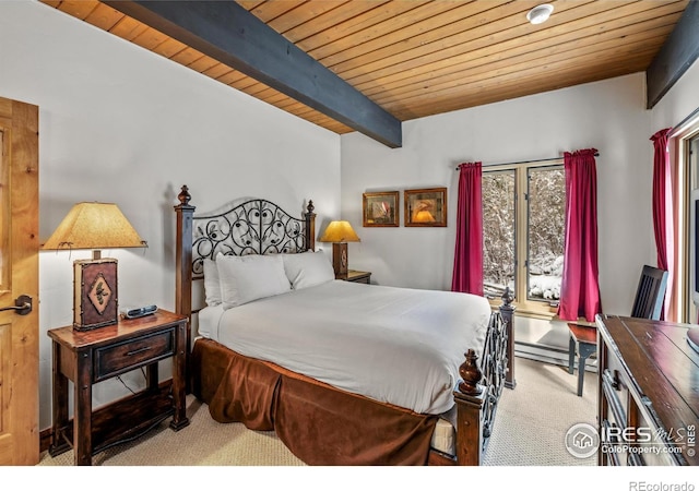 bedroom featuring beamed ceiling, wood ceiling, and carpet floors