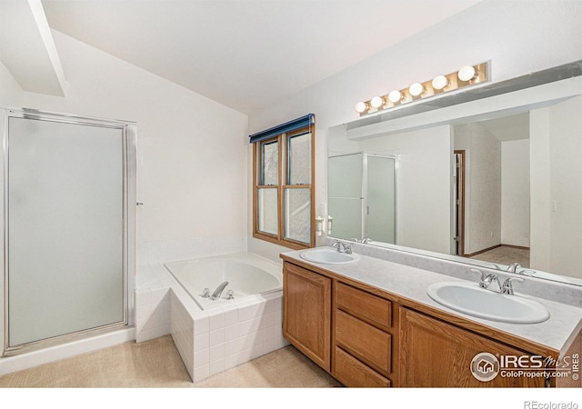 bathroom featuring vanity, shower with separate bathtub, and lofted ceiling