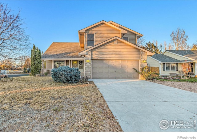 front of property featuring a garage and a front yard