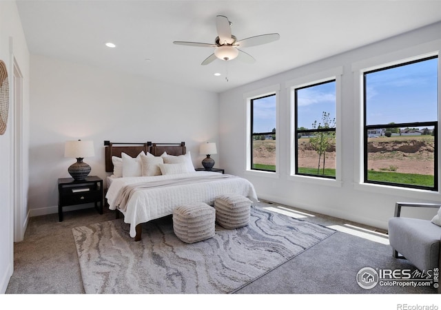 carpeted bedroom featuring ceiling fan