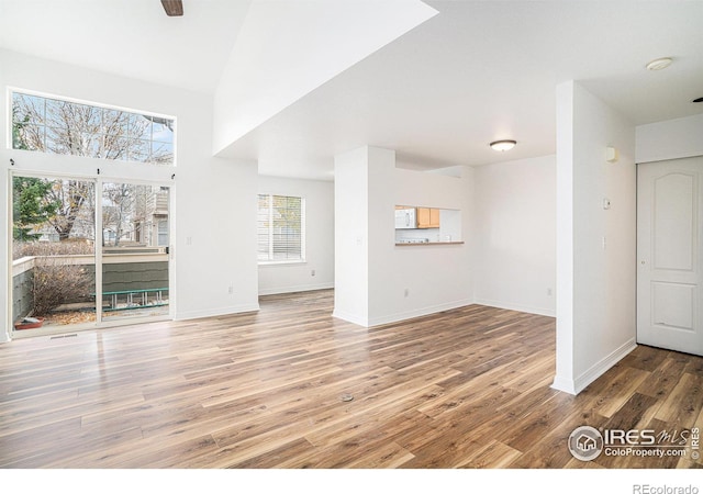 unfurnished living room with hardwood / wood-style floors