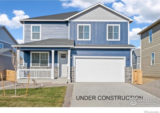 craftsman house with a garage, a front yard, and covered porch