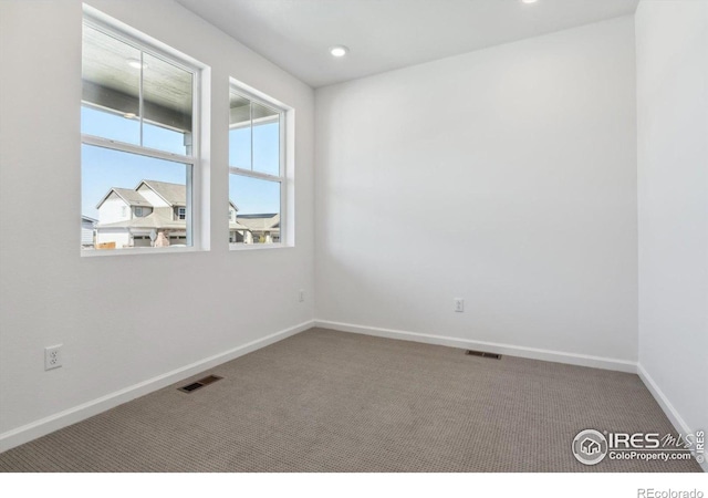 unfurnished room featuring carpet flooring