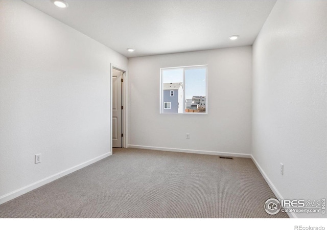 empty room with carpet flooring