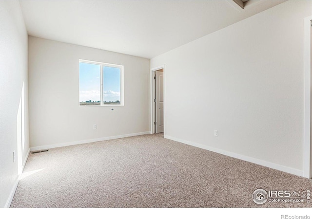 unfurnished room featuring carpet flooring