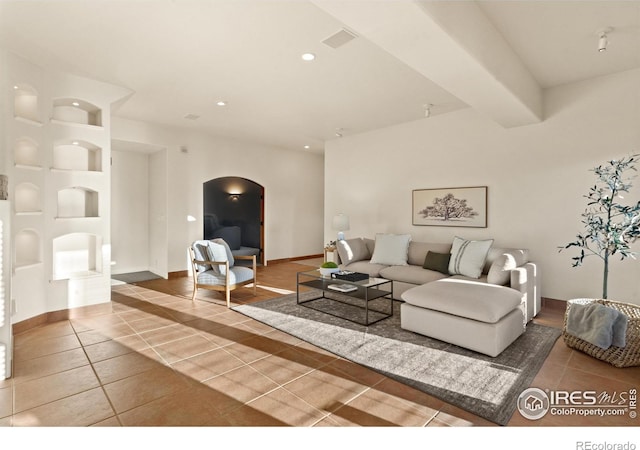 living room with tile patterned floors