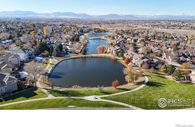 bird's eye view with a water and mountain view