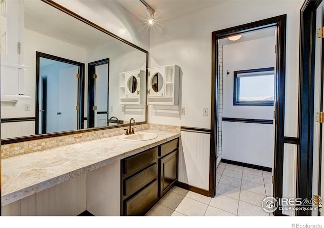 bathroom with tile patterned flooring and vanity