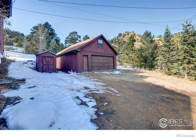 view of snow covered garage