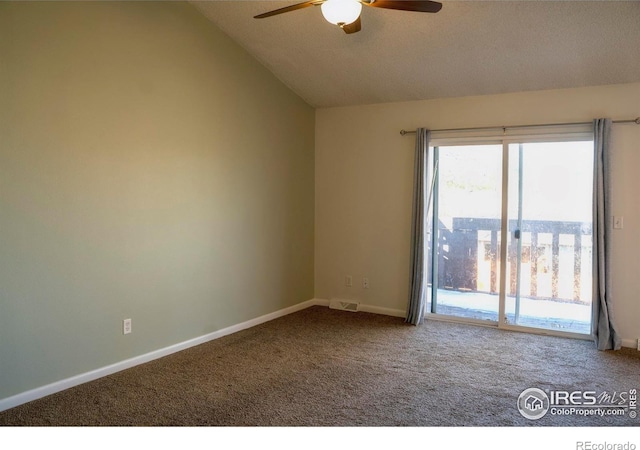 spare room featuring carpet flooring, ceiling fan, a textured ceiling, and lofted ceiling