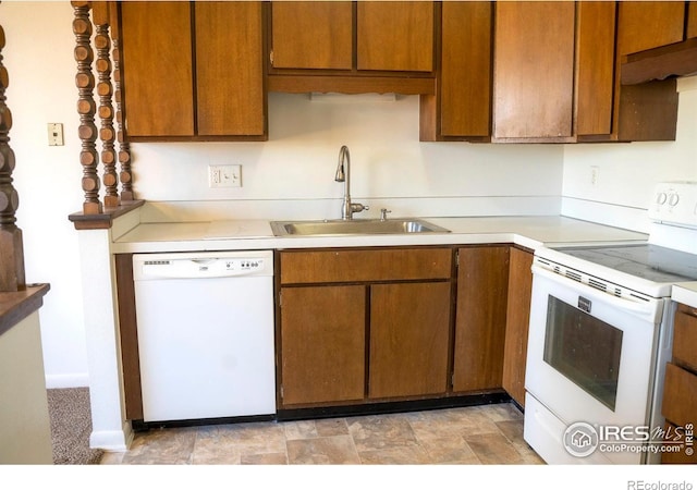 kitchen with sink, extractor fan, and white appliances