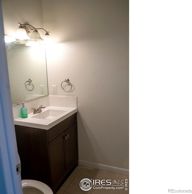 bathroom featuring tile patterned floors and vanity