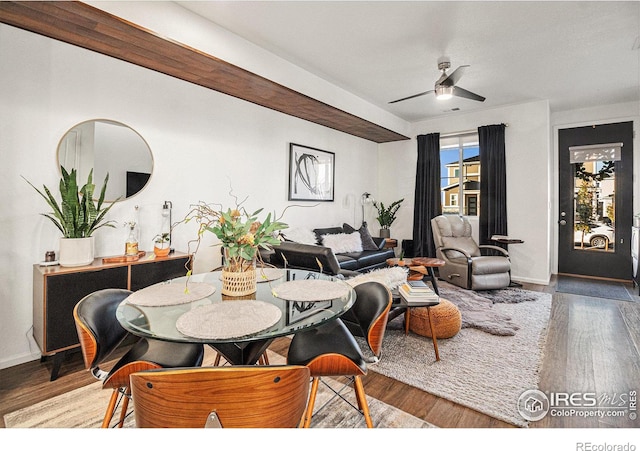 dining room featuring wood-type flooring and ceiling fan