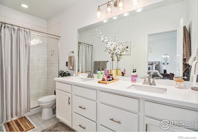 bathroom featuring vanity and a shower with door