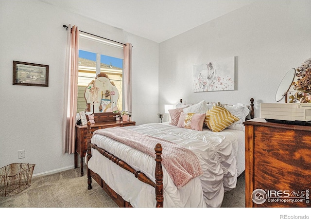 bedroom featuring light colored carpet